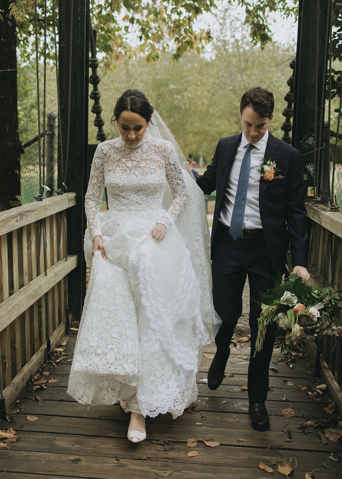 Bride and groom walking at Freedom Park, Charlotte. Reem Acra wedding dress